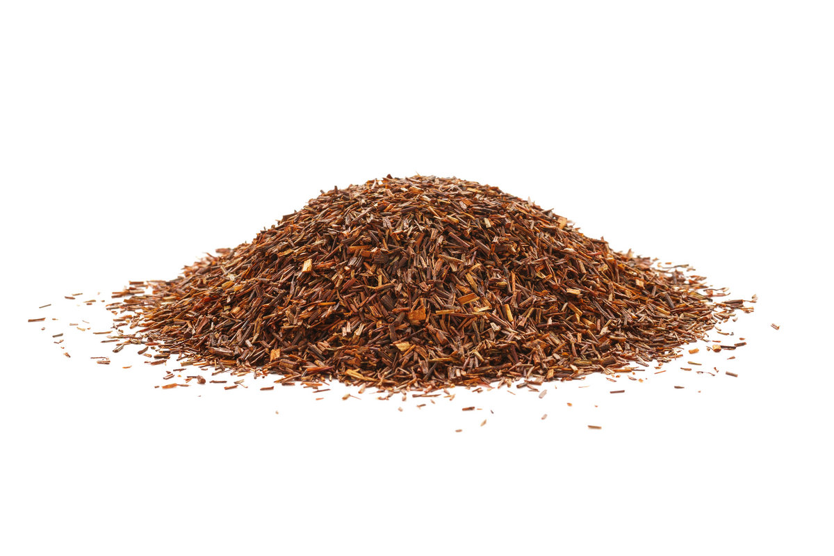Heap of rooibos tea leaves isolated on white background.
